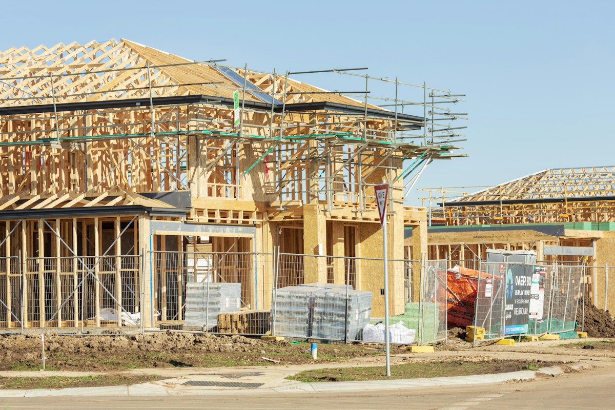 Wooden framed houses under construction showing engineered timber structure